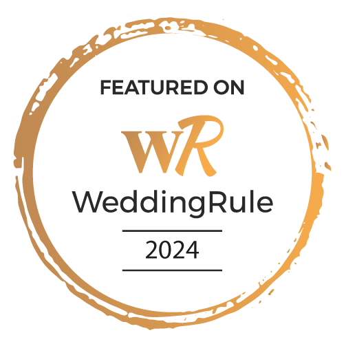 Featured on WeddingRule 2024" badge with golden circular border and white background.