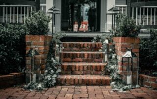 A key west wedding officiant leading a ceremony on a brick walkway.