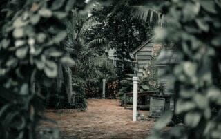 A picturesque garden path leading to a charming house, perfect for Key West weddings.