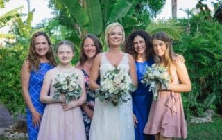 A group of bridesmaids pose with the bride for a photo during a Key West wedding.