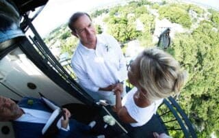 A bride and groom exchange vows on top of a tower with the assistance of a Key West wedding officiant.