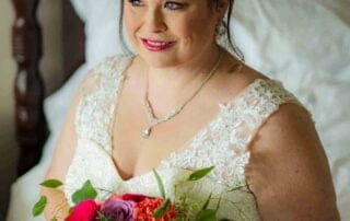 A bride in a wedding dress holding a bouquet captured by a skilled key west wedding photographer.