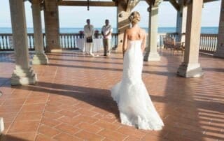 A bride walks down the aisle at a picturesque beach wedding captured beautifully by a Key West wedding photographer.