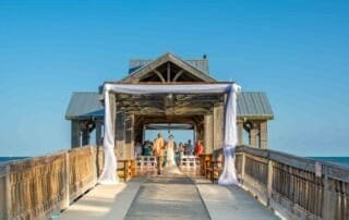 An enchanting wedding ceremony on a wooden pier in Florida, made even more memorable with the expertise of key west wedding planners.
