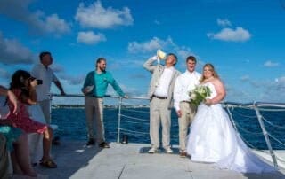 A picturesque boat wedding ceremony in Key West, expertly organized by our experienced Key West wedding planners. Our talented Key West wedding photographer will capture precious moments as the blissful bride and groom exchange