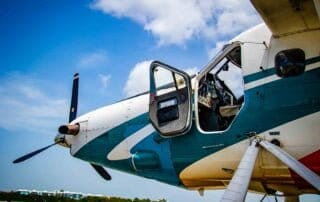 A small airplane with propellers on the tarmac at Key West Airport