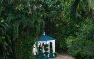 A tropical garden with a gazebo, perfect for intimate Key West weddings.