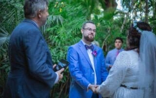 A couple exchange vows in the jungle with the assistance of a key west wedding officiant.